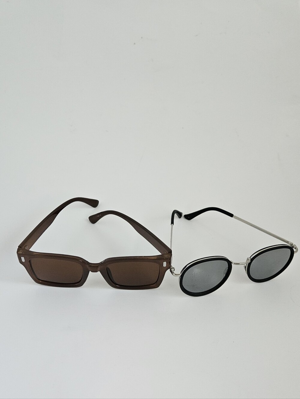 2 Pairs Of Sunglasses